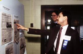 Tim Hennagir and Steve Adrian look at the Chronicle newspaper, St. Cloud State University