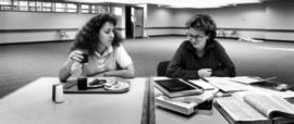 Two women study together at Garvey Commons (1963), St. Cloud State University