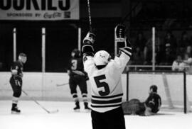 A hockey player celebrates a goal, St. Cloud State University