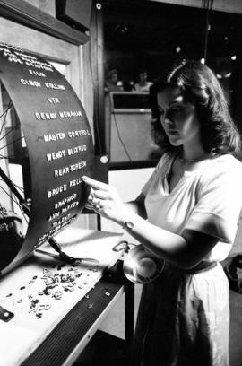 Student Ann Parker creates credits for a television program at a Mass Communication workshop, St. Cloud State University