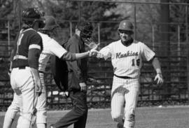 Joe Martin scores a run during a St. Cloud State University baseball game against Augsburg College