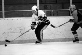 St. Cloud State University hockey player Nick Hackett handles the puck during a hockey game against St. Scholastica