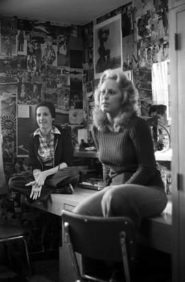 Lisa Faust and Diane Puff sit together in their dormitory room in Mitchell Hall (1958), St. Cloud State University