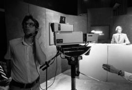 Student Jim Halbakken operates a television camera during a program at a Mass Communication workshop, St. Cloud State University