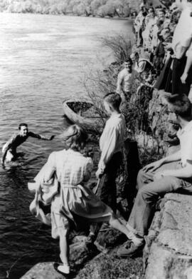 Man steps out of the Mississippi River after swimming across it, St. Cloud State University