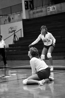 Volleyball player Becky Stream watches a teammate hit a volleyball during a match, St. Cloud State University