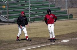 Mike McKinney stands on third base with Dennis Lorsung nearby during a baseball game, St. Cloud State University