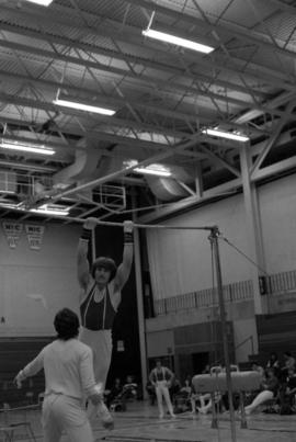 A gymnast performs on the high bar, St. Cloud State University