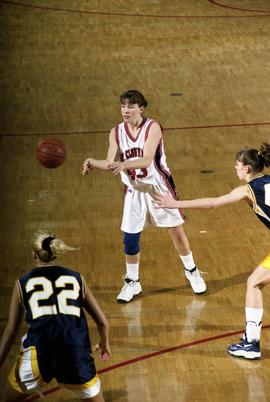 St. Cloud State women's basketball player Tina Schreiner passes the ball against Augustana College