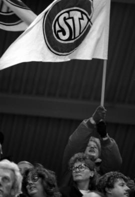 Kia Croone waves a flag during St. Cloud State University and Lake Superior State University men's hockey game