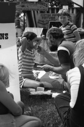 A girl gets her face painted, Lemonade Fair, St. Cloud State University