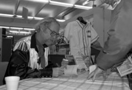 Author W.P. Kinsella signs autographs, St. Cloud State University