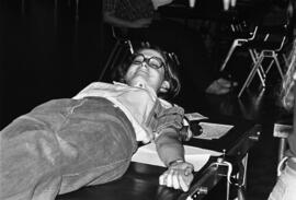 A woman gives blood during the Tau Kappa Epsilon blood drive, St. Cloud State University