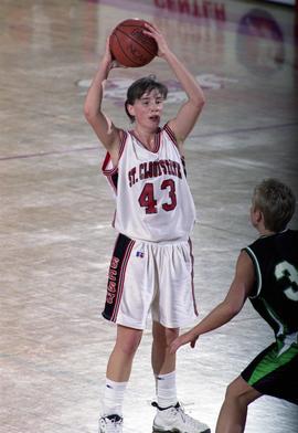 St. Cloud State women's basketball player Tina Schreiner looks to pass the ball against the University of North Dakota