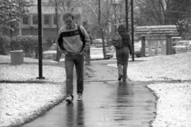 Students walk on campus while it snows, St. Cloud State University