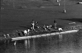 Rowing Club members prepare their boat for launch on the Mississippi River