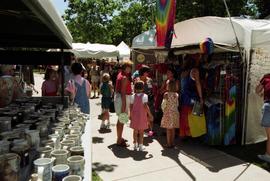 People look at merchandise at a vendor's booth, Lemonade Concert and Art Fair, St. Cloud State University