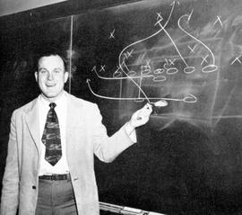 Football coach Bill Heiss draws up a play, St. Cloud State University