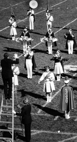 Marching band performs at a football game, St. Cloud State University