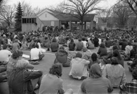 People listen to a speech, Day of Peace protest, St. Cloud State University