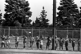 Spectators line the outfield fence during a St. Cloud State University baseball game against Northern State University